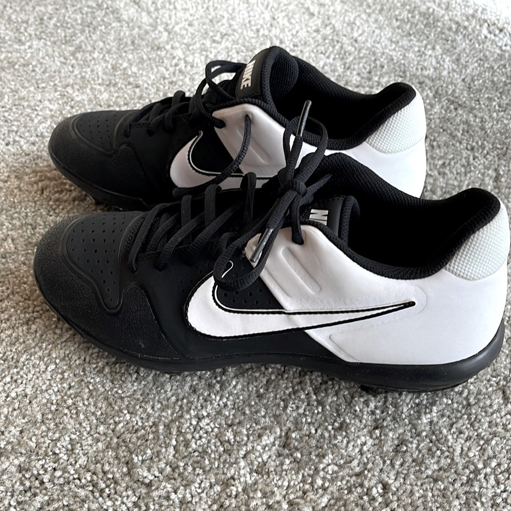 Brand new never worn, baseball cleats. Size 8.5